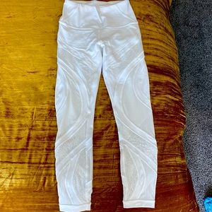 Lululemon white leggings with lace detail on the legs. Worn  1x, small for me.
